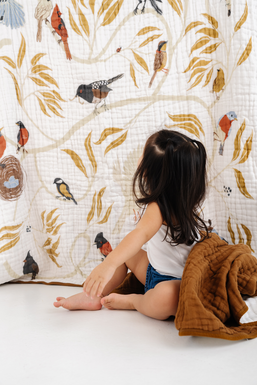 "Large throw blanket with colorful bird print illustration on soft fabric