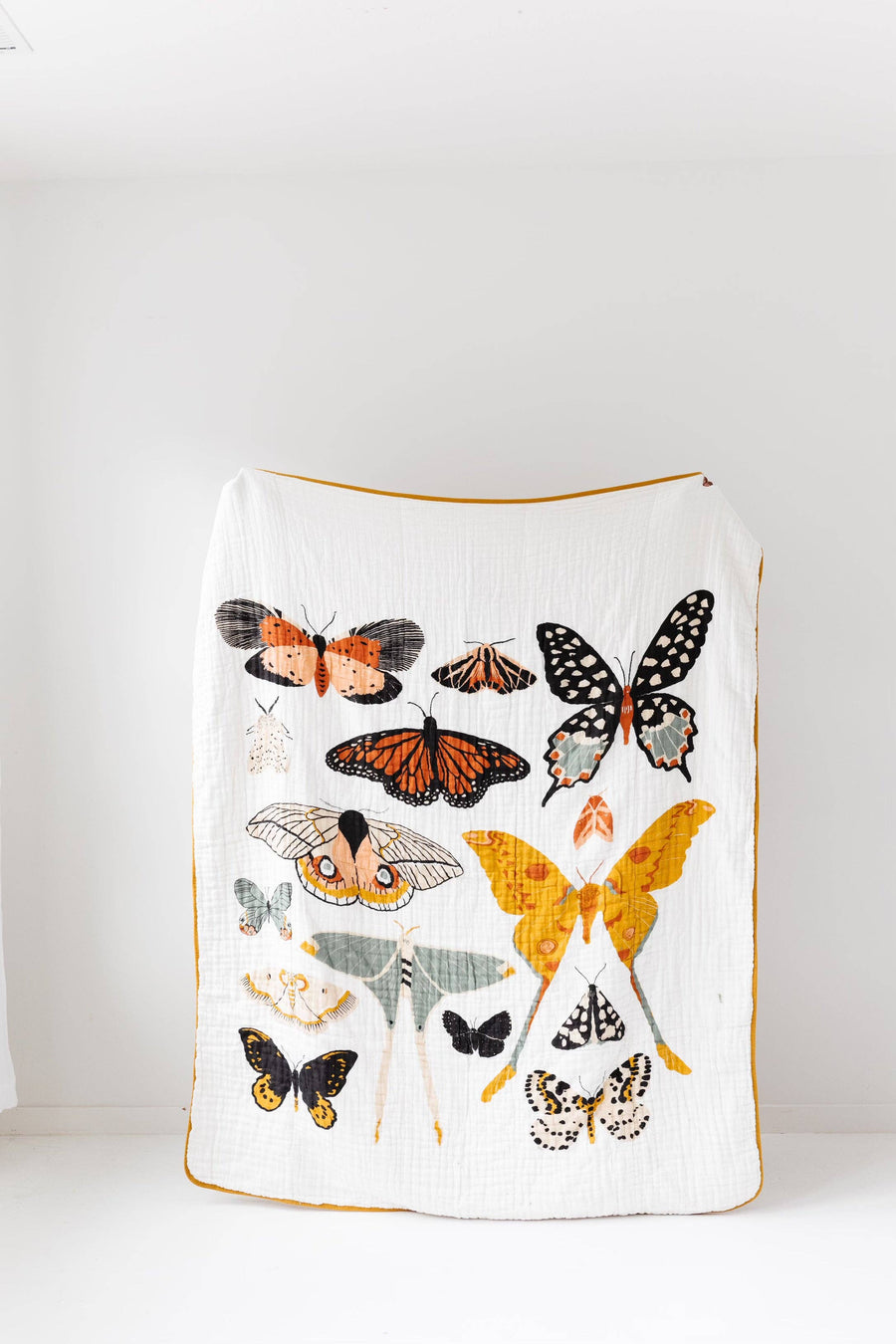 Large throw blanket featuring butterfly collector botanical print on cozy fabric